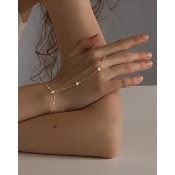 Bijou de main doré avec zircone